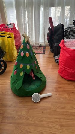 Christmas cat bed, toys, and brush
