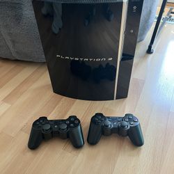 PlayStation 3 with Controllers + Portal 2
