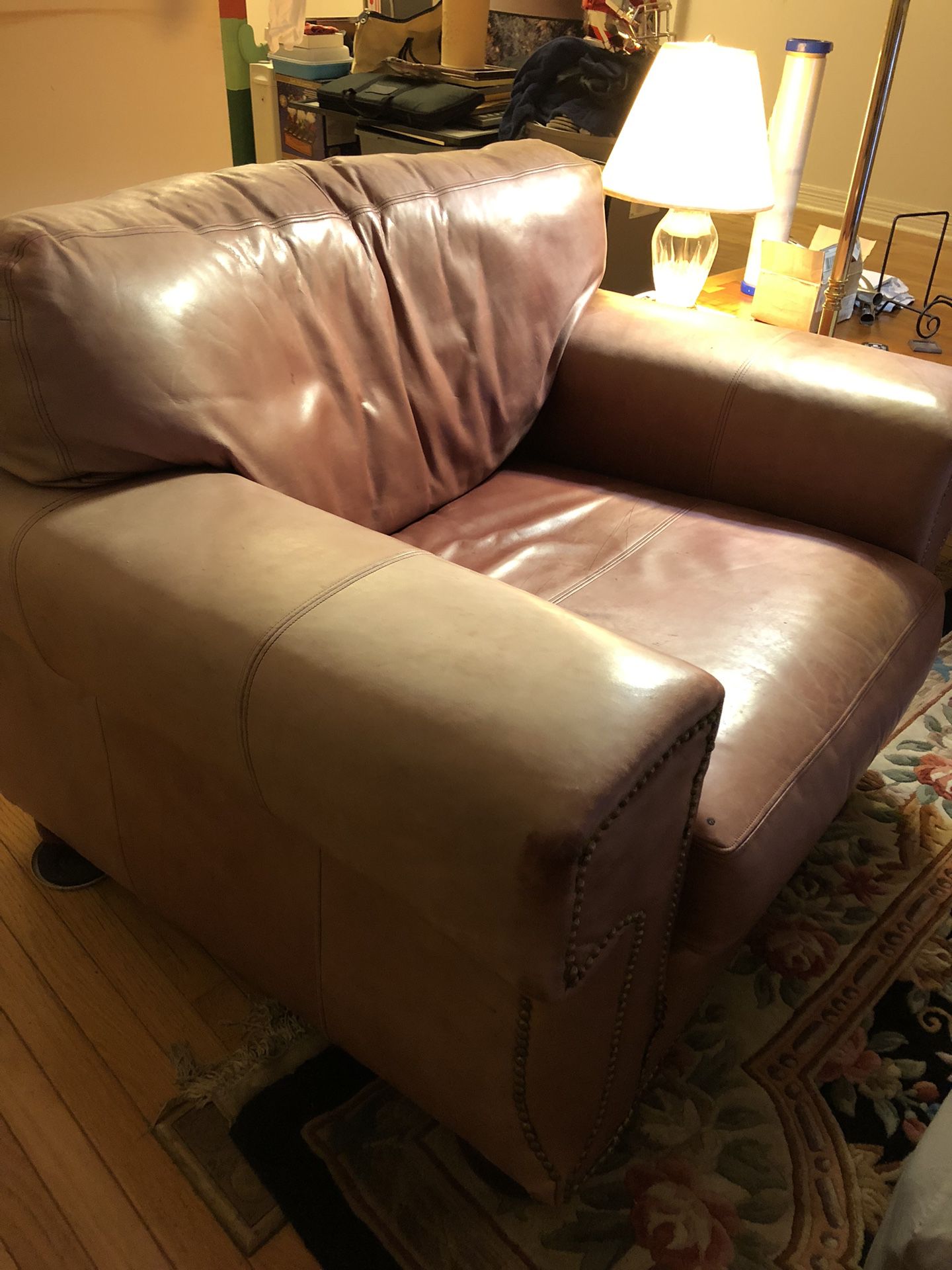 Salmon color leather chair & ottoman 