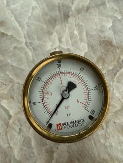 Hydraulics pressure gauge with a brass casing and a dual-scale display