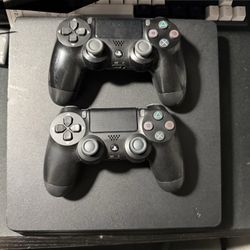 PS4 And 2 Controllers With Games 