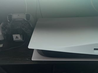 Ps5 disc edition with 2 controllers and a charging station