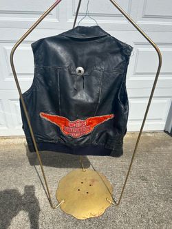 Men’s large vintage Harley Davidson vest with zipper. Has an ice patch on the back and a small one on the front. Also has some kind of silver buckle o