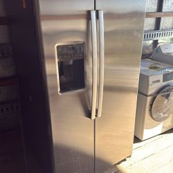 GE side-by-side refrigerator with water and ice dispenser