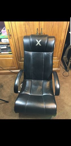 X rocker model 51231 video chair very comfortable. It has two speakers and one subwoofer with input and output for audio. Includes power adapter for