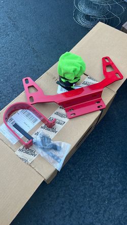 Red Powder Coated driveline loop Bracket Kit for a 2007 to 2014 mustang