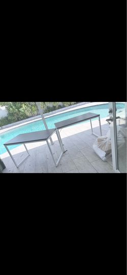 2 gray metal and laminate desks
