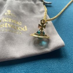 Vivienne Westwood gold necklace with blue orb