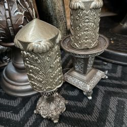 Small Candle And Candle Holder And One Is Bigger 