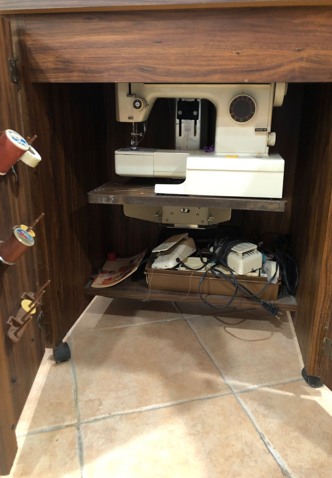 Kenmore sewing machine in a wood furniture piece