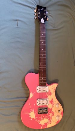 First act  Pink Electric Guitar with Splatter Design