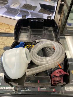 Paint sprayer in black case