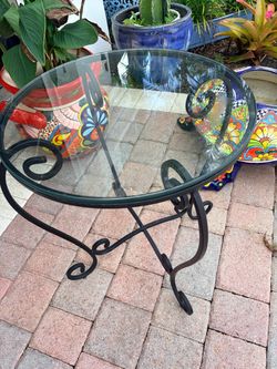 Glass top wrought iron  table in perfect condition