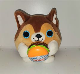 Lucas the puppy from Zuru Snackles Series 2, holding a licensed Sonic Drive-In burger.