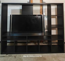 Nice big TV stand for big TVs with shelves in good condition, it's in the garage for easy pickup, the dimension in the post,I can take it apart for pi