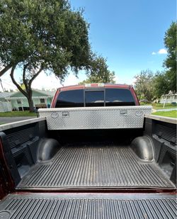 Crossover toolbox for pickup truck bed