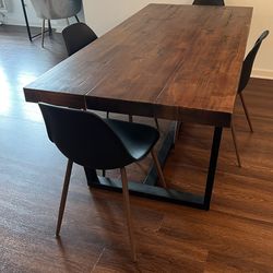 Large wooden dining room table with 4 chairs