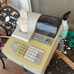 A Casio cash register . Plug it in before you buy it