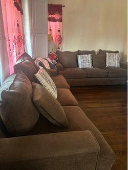 2 brown couches