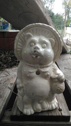 Tanuki. Lush teddybear with giant balls statue