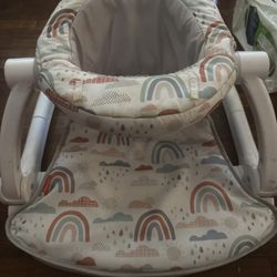 Fisher-Price Portable Baby Chair Sit-Me-Up Floor Seat with Developmental Toys & Machine Washable Seat Pad, Rainbow Showers