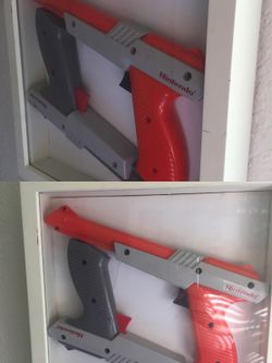 Framed Nintendo zapper.