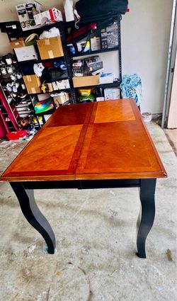 Elegant solid Wooden Dining Table with Black Curved Legs.