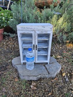 Shabby chic white cabinet.