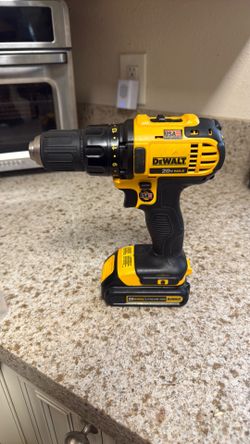DeWalt DCD771 20V MAX drill/driver with a battery.