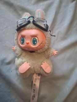Labubu wearing goggles.