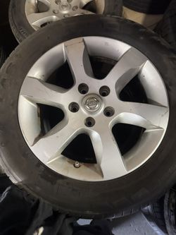 Rim And Tires For A Nissan 