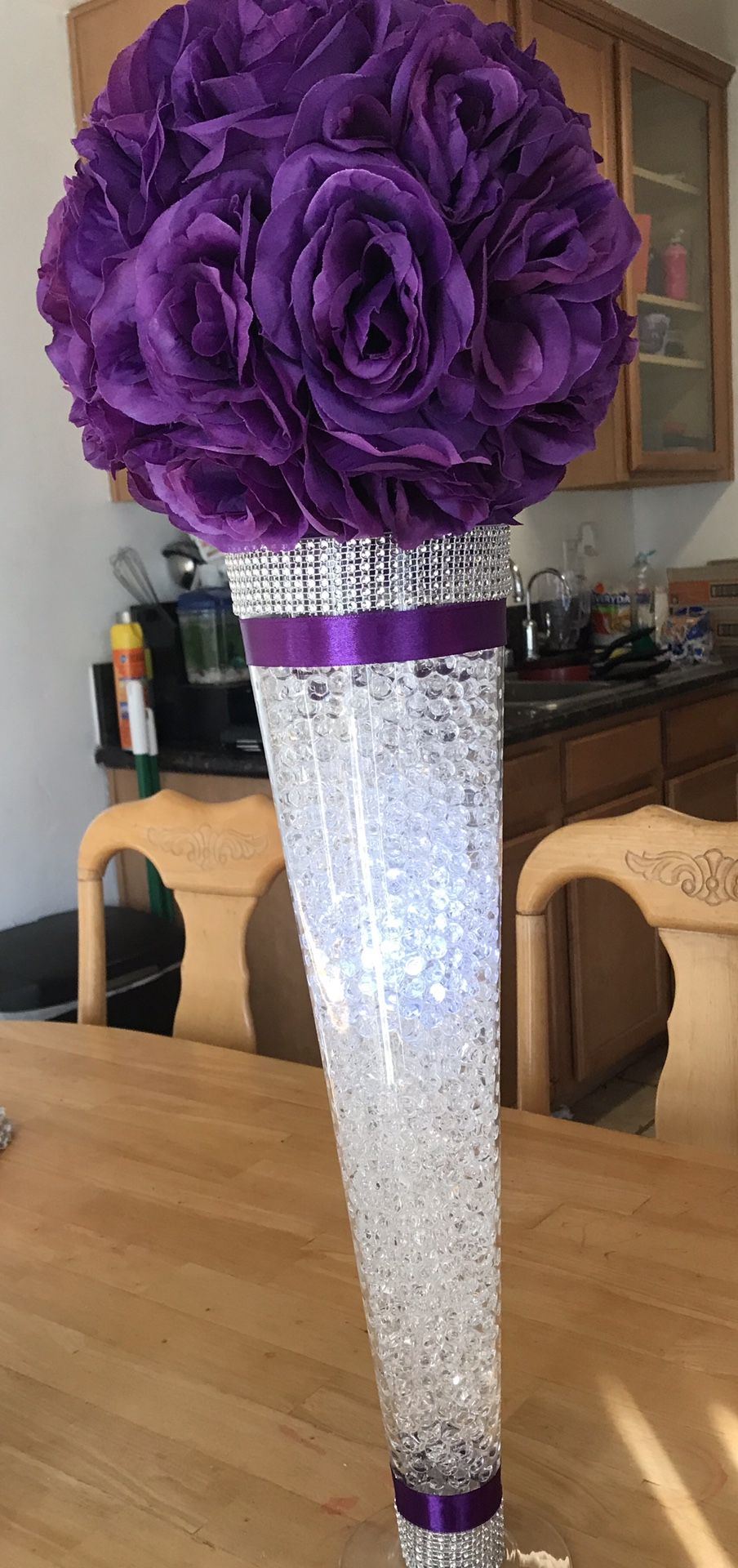 Glass centerpieces and flower balls (purple and teal)