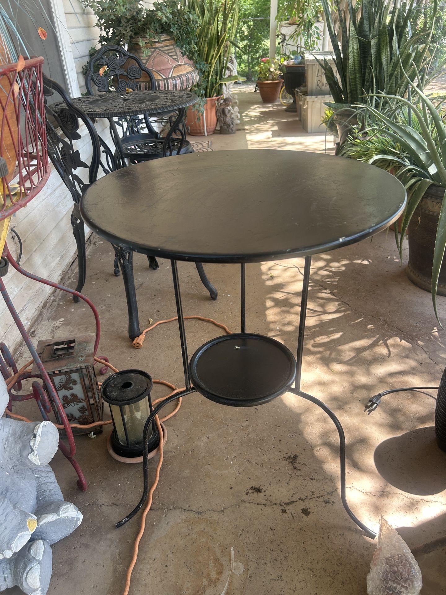 A metal table it’s 26 inches tall and 20 inches across the top