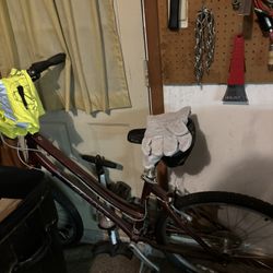 Bike, Leather Gloves, And A Reflector Vest