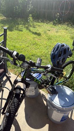 Mountain bike with helmet and front and back light and a water bottle holder