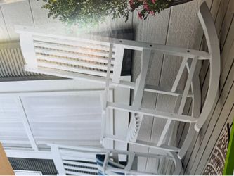 Two New wooden rocking chairs white $100. Dollars each