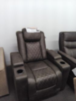 Power Recliner Chair In Faux Leather, Features Storages And Cup Holders. 