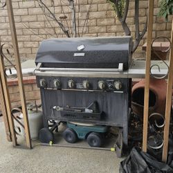 FREE – Kenmore 5-burner propane gas grill with side burner and propane tank included.