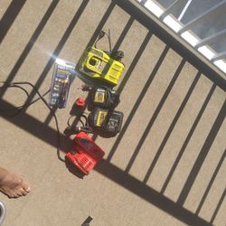Drill Battery Chargers And One Milwakee Battery And A Voltage Detector