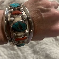 This is a vintage Navajo-made Kingman turquoise and coral sterling silver cuff bracelet