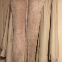 Local designer. Leather with fur trim. Size M