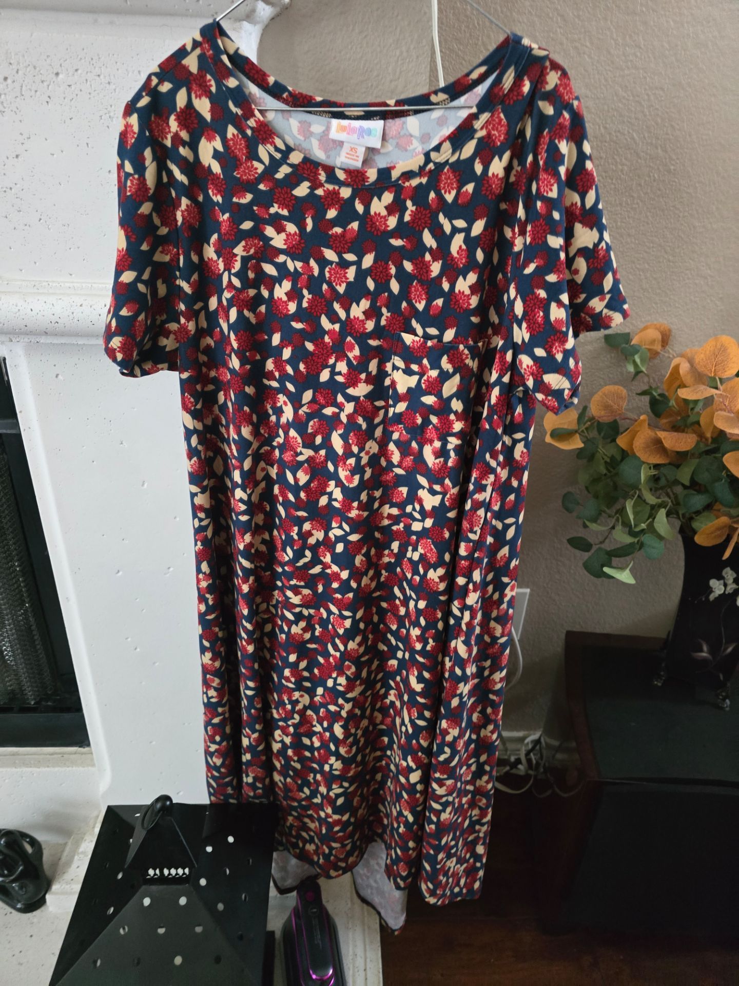 Lula Roe Flowing navy maxi with an all-over red and cream floral motif. Soft drape creates an easy, flattering silhouette. Short sleeves and a simple