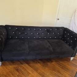 Black couch with gem stones