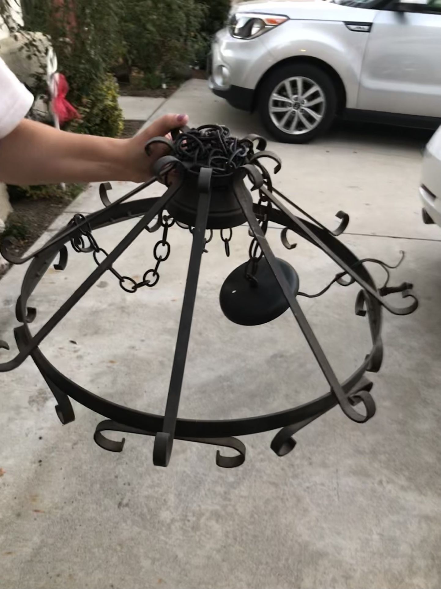Vintage wrought iron pot rack with light fixture.