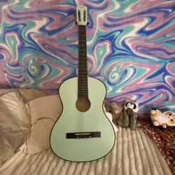 Turquoise nylon string acoustic guitar 