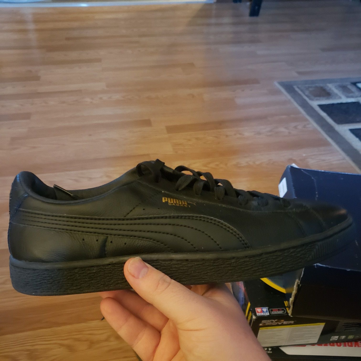 Black & gold puma shoes