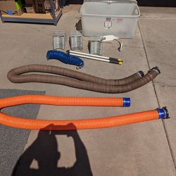 50' of RV Sewer Hoses, Water Hose, Hose Supports and 2 Clean Out Wands.