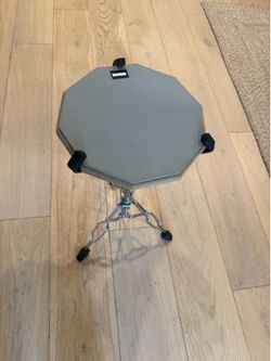 Drum practice pad with adjustable stand