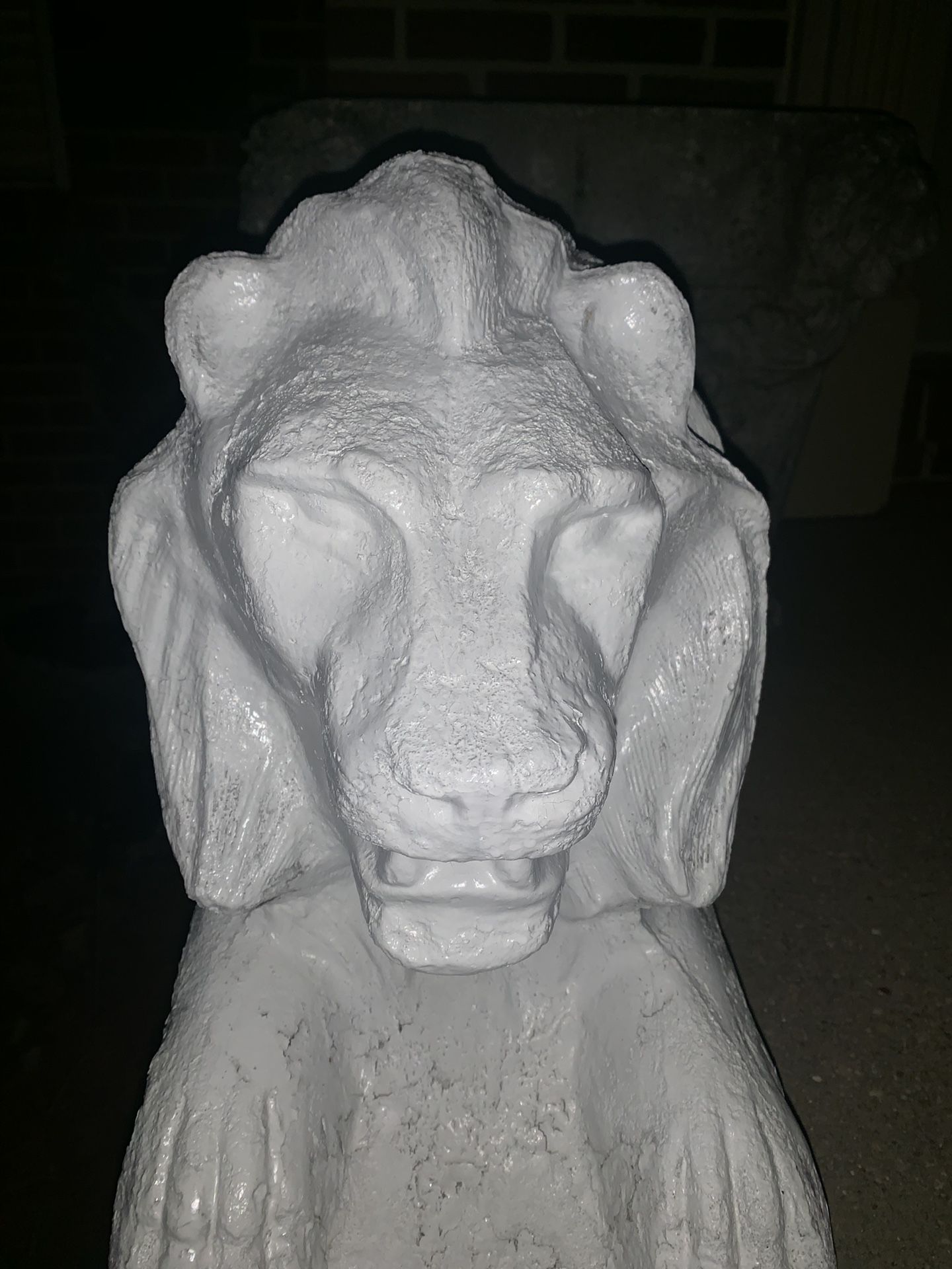 Two large stone white lions