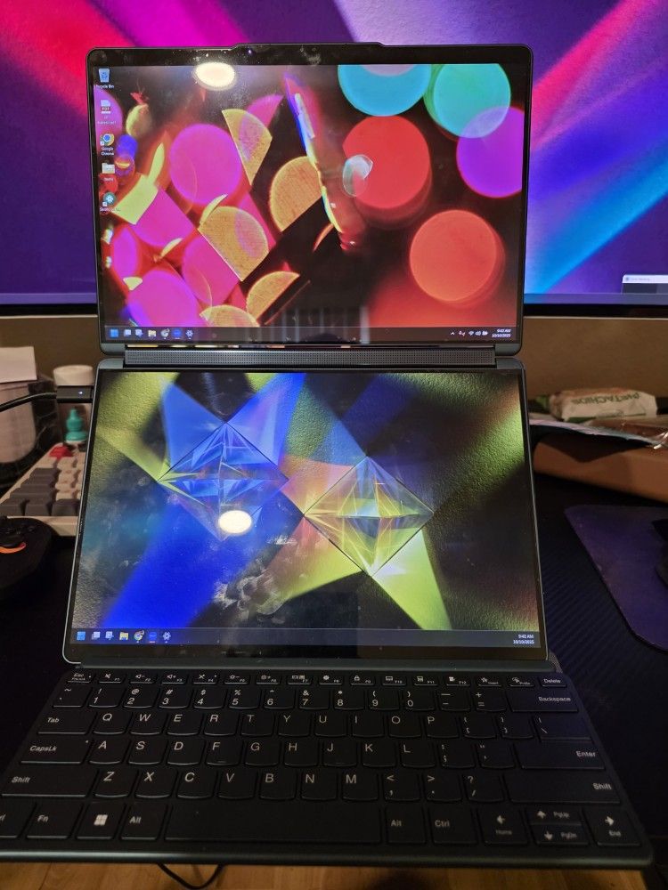 Lenovo Yoga Book 9i Dual Touch Screen With Stylus. It Has A Vinyl Wrap Cover And Screen Protector Inside